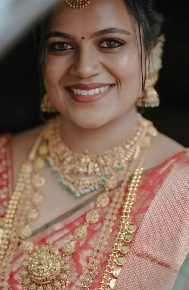 Kerala bride in traditional gold jewellery, close-up bridal makeup