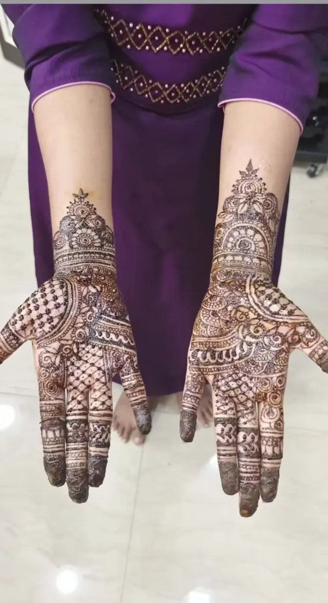 Intricate bridal mehendi henna design on both hands